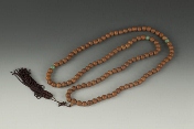 A strand of 108 walnut prayer beads