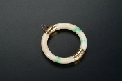 A jadeite bangle with gold cover