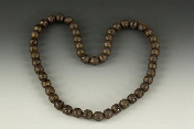 A strand of agate beads with silver cover