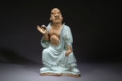 A ceramic Buddha figure