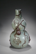 A large porcelain gourd vase with gourd decorations
