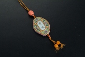 A green Chinese porcelain pendant