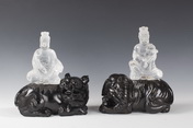 A PAIR OF QUARTZ CARVED GUANYIN FIGURES WITH SPINACH JADE CARVED BEASTS