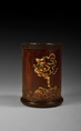A BAMBOO BRUSH POT WITH EMBELLISHMENTS