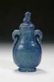 A CARVED LAPIS LAZULI TWO RING HANDLE BOTTLE VASE