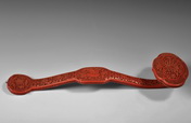 A CARVED CINNABAR LACQUER SCEPTER