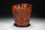 A CARVED HUANGHUALI BRUSH POT WITH ZITAN BASE