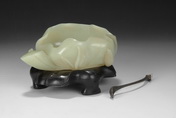 A WELL CARVED GREEN JADE BRUSH WASHER