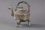 An ancient bronze tripod teapot