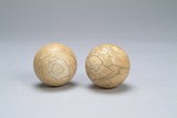 Two (2) ivory fitness balls