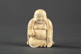 A Japanese ivory carved Buddha