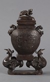 A bronze decorated lidded jar