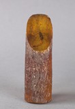 A scorpion encased in amber ornament