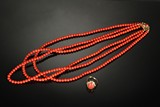 A THREE STRAND CORAL NECKLACE AND CORAL RING