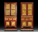 A PAIR OF LARGE SPLASH PAINTED GOLD AND CARVED COMPOUND CABINET