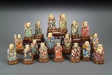 A SET OF EIGHTEEN PAINTED IVORY ARHATS