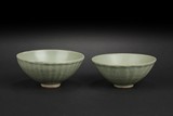 A PAIR OF CELADON GLAZED CONICAL BOWLS