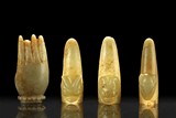 THREE JADE FINGER COVERS & CARVED HAND ORNAMENT
