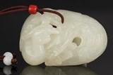 A WHITE JADE CARVED PENDANT OF PHOENIX