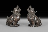 A PAIR OF BRONZE MYTHICAL BEAST ORNAMENTS