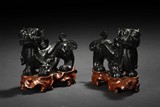 PAIR OF ONYX FOO DOGS ON STANDS