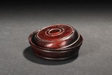 A ZITAN WOOD CARVED ROUND BOX WITH COVER