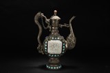 A LARGE PERSIAN STYLE SILVER WINE POT WITH GEMS