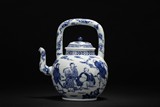 A BLUE AND WHITE 'EIGHT IMMORTALS' TEAPOT