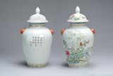 A PAIR OF CHINESE FAMILLE-ROSE JARS WITH COVERS