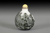A WELL CARVED GLASSSNUFF BOTTLE 