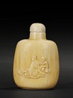 A CARVED IVORY SNUFF BOTTLE