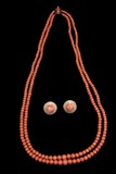 A TWO-STRAND RED CORAL BEAD NECKLACE AND A PAIR OF 14K CORAL EARRINGS