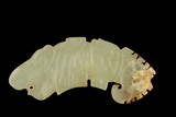 A CELADON JADE CARVING OF 'HUANG' ACCESSORY