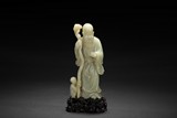 A CARVED WHITE JADE 'SHOULAO AND CHILD' FIGURAL GROUP