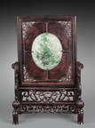 A CARVED HONGMU SCREEN INSET WITH JADEITE PLAQUE