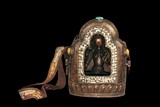 A LARGE TIBETAN DECORATED BRONZE GAHU BOX WITH BRONZE BODHISATTVA