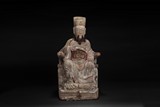 A CARVED WOODEN SEATED CIVIL OFFICIAL FIGURE