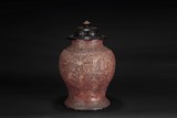 A CARVED LACQUER BALUSTER JAR WITH COVER