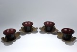 A SET OF FOUR PEKING GLASS CUPS WITH SILVER CUP STANDS