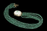A MALACHITE NECKLACE WITH JADE PENDANT AND 14K YELLOW GOLD