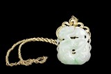 A 14K YELLOW GOLD NECKLACE WITH JADEITE PENDANT