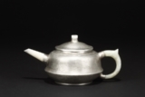 YANG PENGNIAN: A PEWTER-ENCASED YIXING TEAPOT AND COVER
