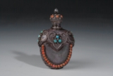 A JEWELED SILVER SNUFF BOTTLE