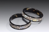 A PAIR OF SILVER GILT AND ENAMELLED TORTOISESHELL BANGLES