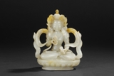 A CARVED WHITE AND RUSSET JADE FIGURE OF VAJRASATTVA