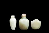 A GROUP OF THREE JADE SNUFF BOTTLES