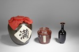 TWO CHINESE WINE JARS AND ONE BOTTLE