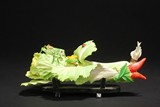 A BONE CARVED CABBAGE DISPLAY