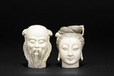 TWO CARVED IVORY HEAD FIGURES