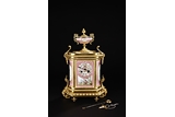 AN ANTIQUE FRENCH GILT BRASS MANTEL PORCELIAN CLOCK BY HP & CO.